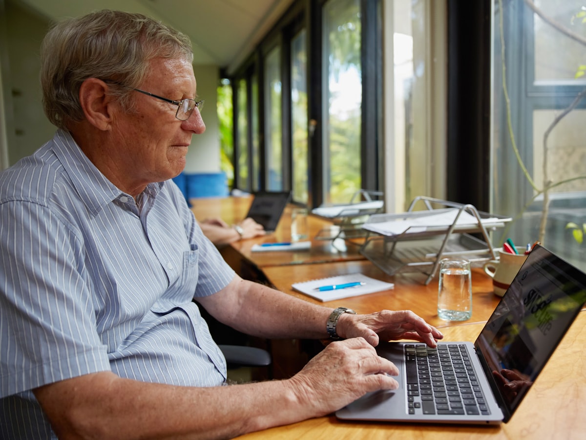 A man working alone at a laptop.